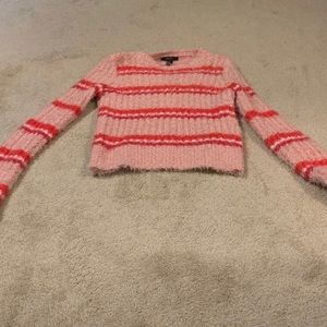A long sleeve pink sweater